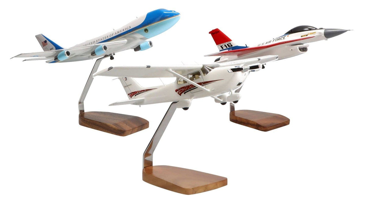 Air Force One, Cessna 172 and F-16 mahogany aircraft models on wood stands